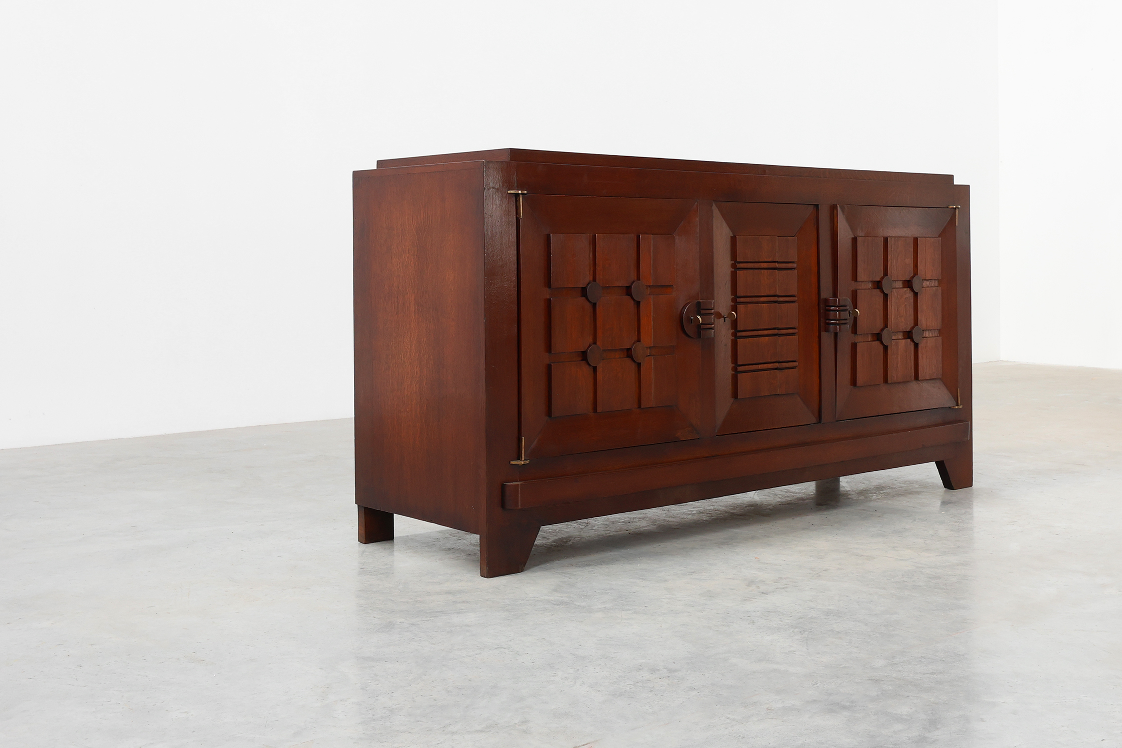 Art Deco carved geometric sideboard by Charles Dudouyt in oak, France ca. 1940thumbnail